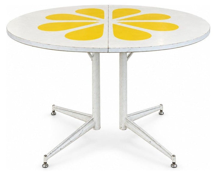 White / Yellow mid-century dining table with a two-tone laminate top and tapered legs.