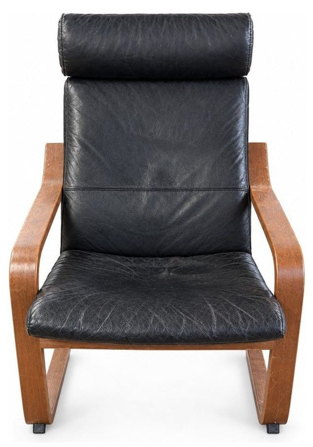 Black lounge chair with distressed fabric upholstery