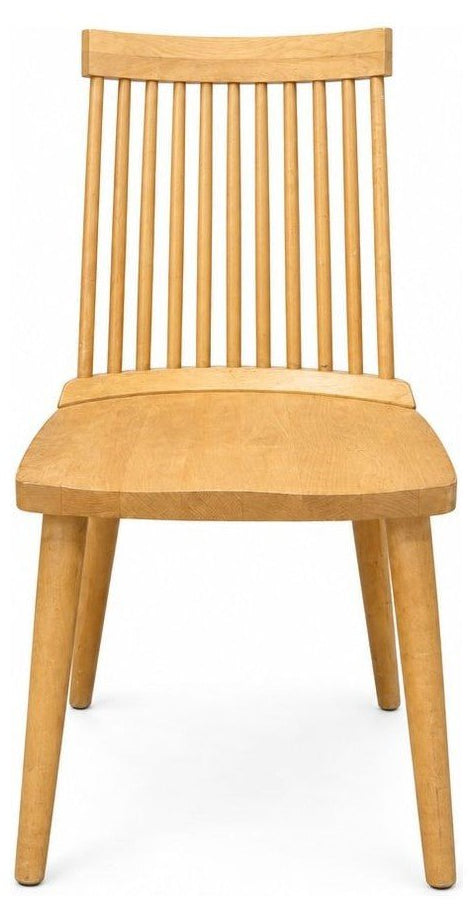 Blonde dining room chairs with tapered wood frames, shown as a set of four.