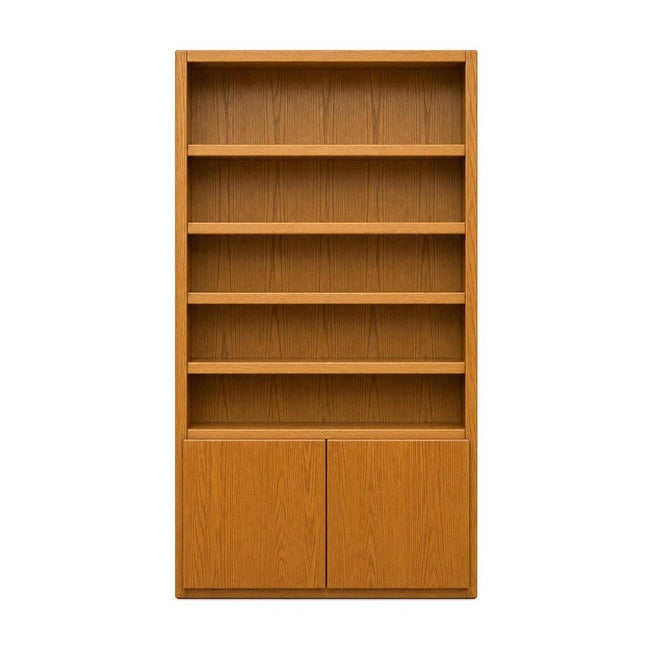 Golden Oak mid-century bookcase with tall open shelves and vertical wood grain.