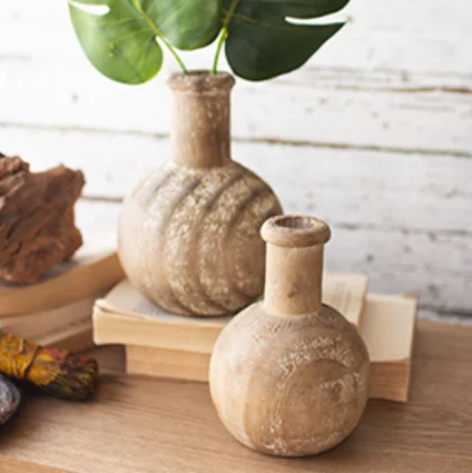 Pair of Round Carved Wooden Bottles