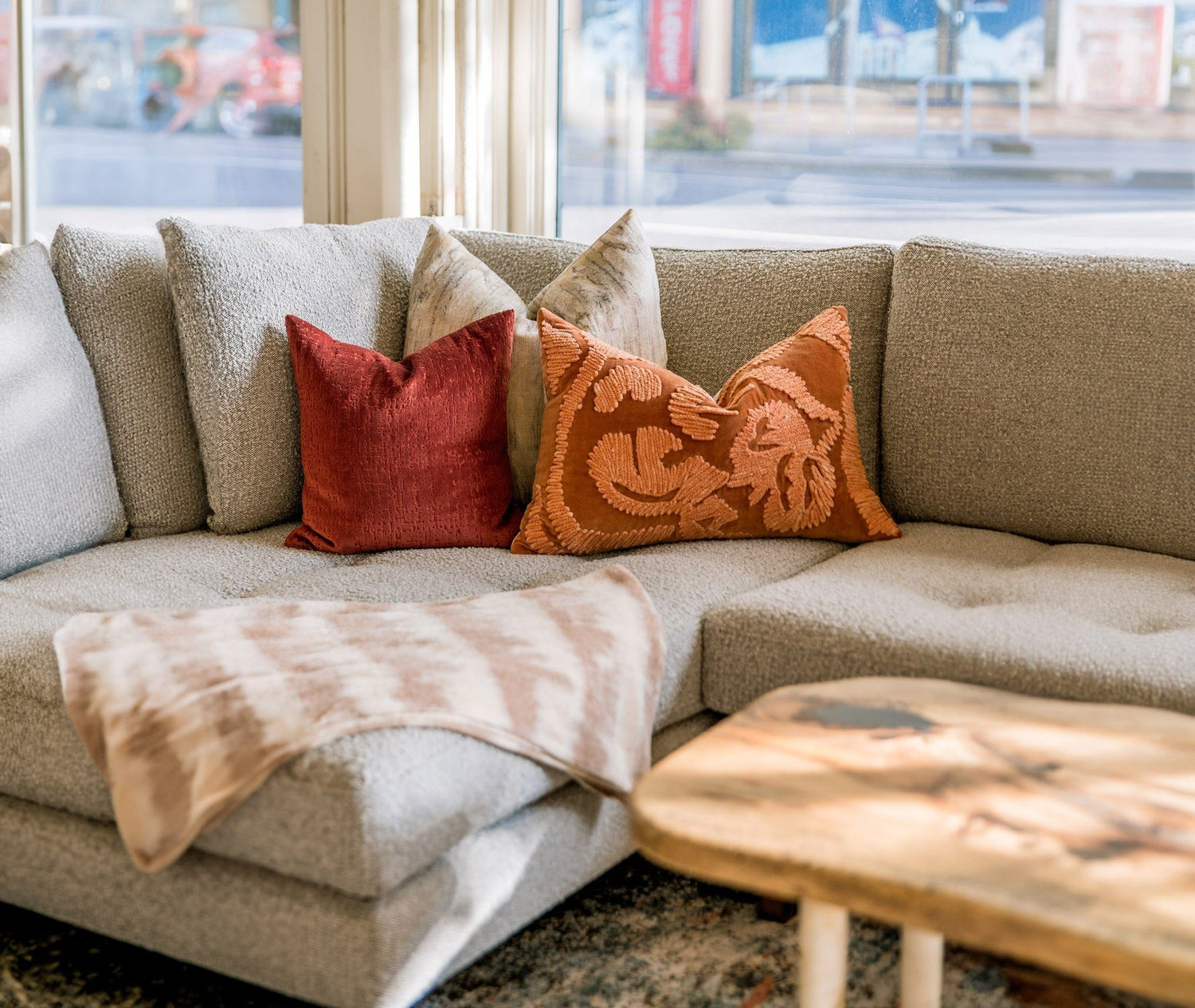 Customizable sofa with designer pillows at What's New Furniture Portland showroom