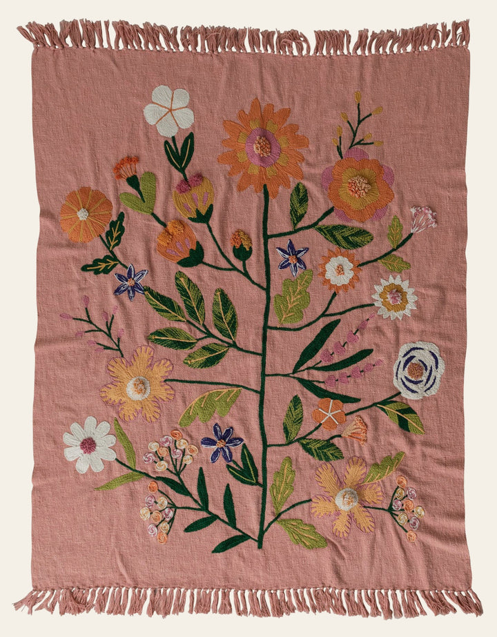 Woven Cotton Throw with embroidered flowers and fringe in dusty peach laid flat showing the full botanical design - by Creative Co-Op - Whats New Furniture Portland OR
