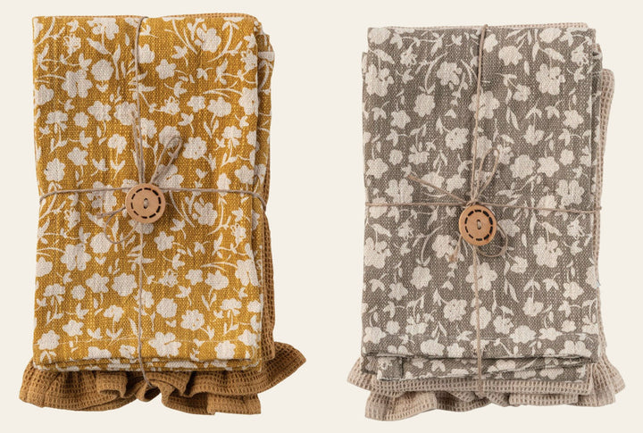 Mustard floral and taupe cotton tea towels folded and tied with a wood button - Whats New Furniture Portland OR