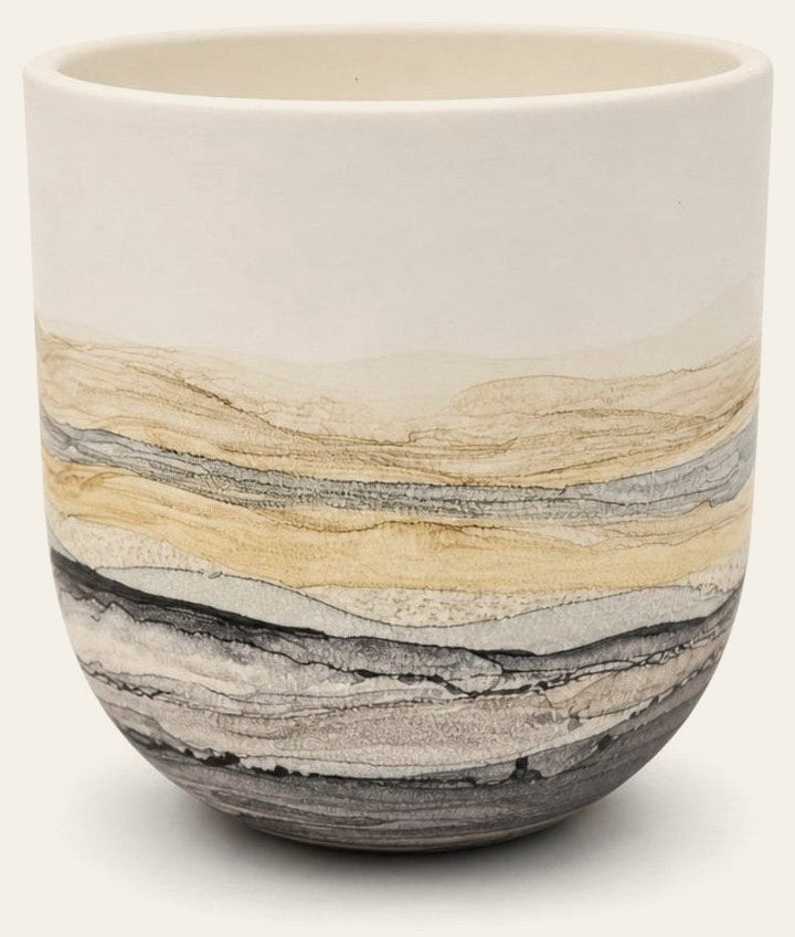 White ceramic wall-mounted planter vase with hand-painted surface