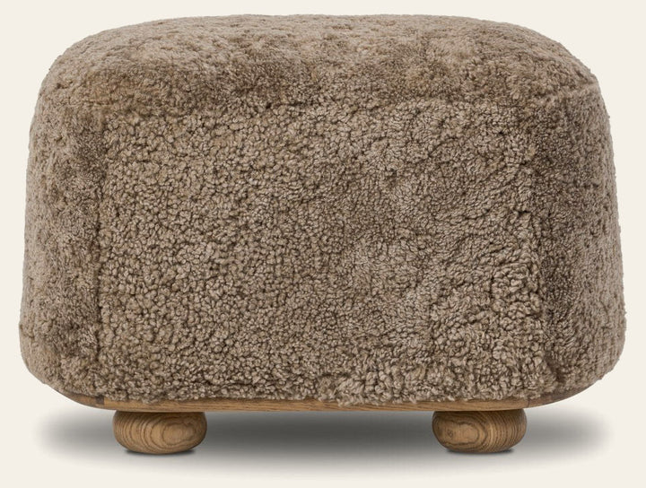 Bilbury Oval Ottoman in Taupe Shearling front studio view - Whats New Furniture Portland OR