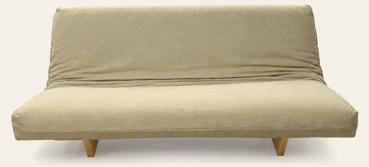Beige futon sofa with a machine-washable cover and low rectangular silhouette.