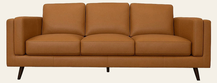 Eager top-grain leather sofa in camel on a white studio background, side pillow attached to each arm - What's New Furniture Portland