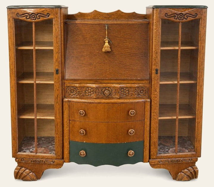 Natural wood secretary desk with tall slim proportions and drop-front silhouette.