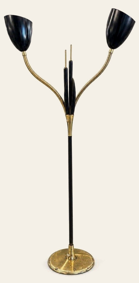 Black and brass vintage cattail double floor lamp with two slender metal stems.