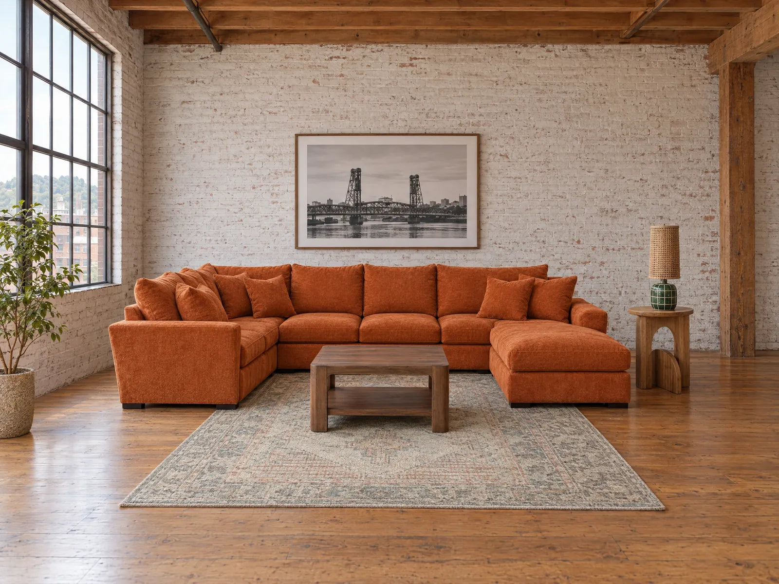 Generated room image: Horizon U sectional in Lush Papaya styled in a Portland brick loft with a walnut coffee table - What's New Furniture Portland