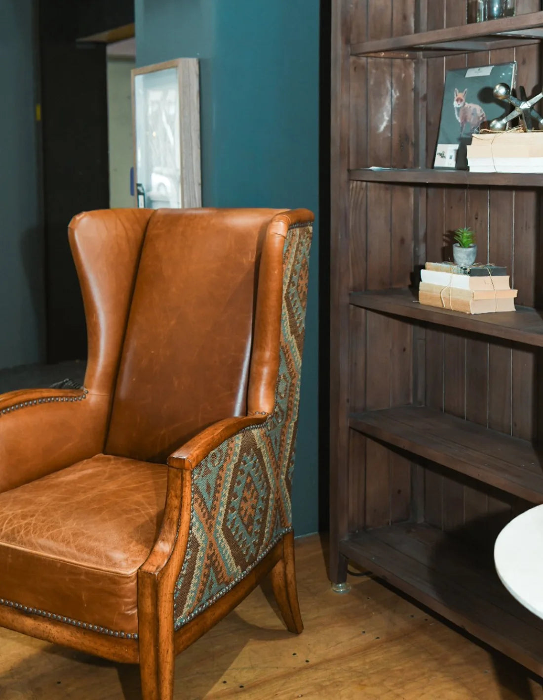 A vintage leather wingback chair from WNF's consignment photography