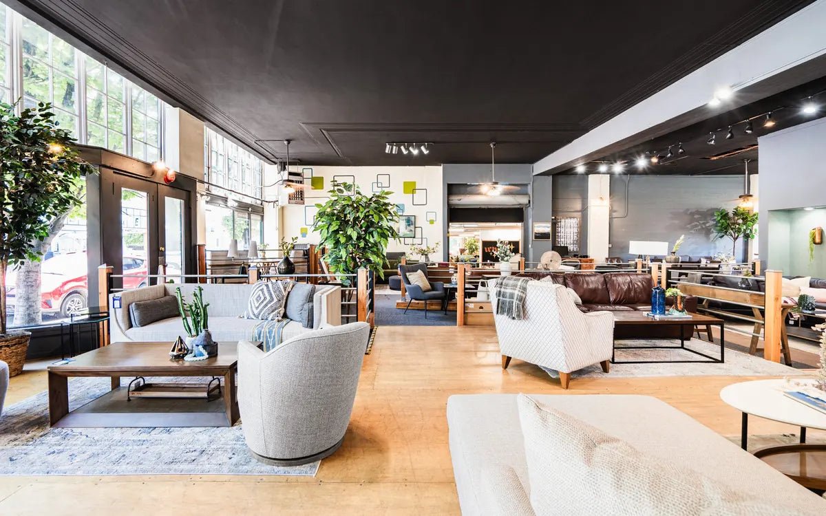 The sales floor of What's New Furniture's Portland store, with sofas, rugs and plants