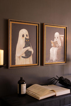 Framed Halloween ghost paintings side by side on a dark wall above an apothecary bottle - ghost wall art by Kalalou - Whats New Furniture Portland OR