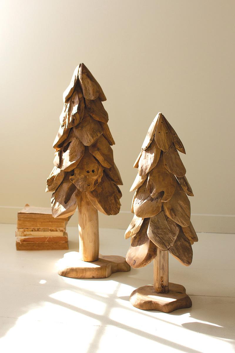 Large rustic teak Christmas tree beside the smaller size in sunlight showing carved petal layers - carved wood holiday decor by Kalalou - Whats New Furniture Portland OR