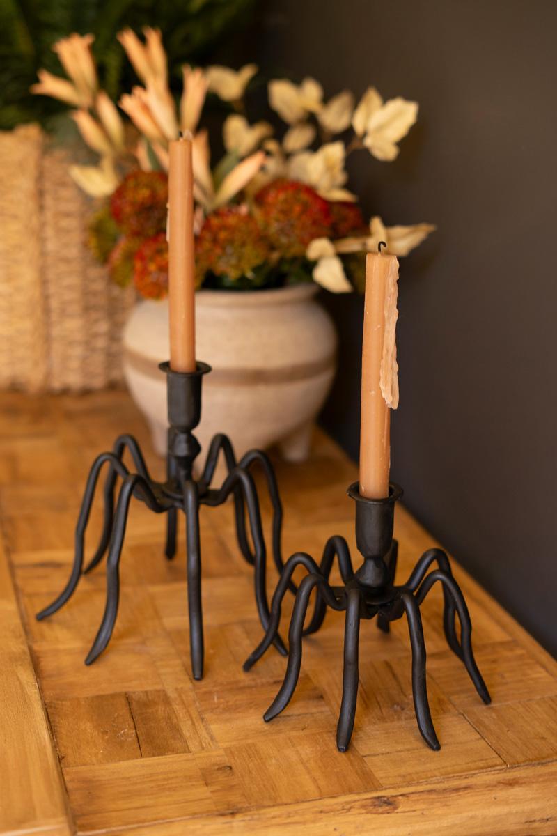 Both cast iron spider candle holders staged beside a woven planter and dried arrangement - forged black candle holders by Kalalou - Whats New Furniture Portland OR