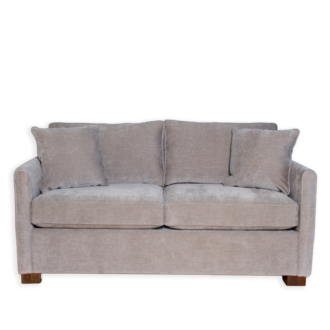 Gray sofa with four cushions on a white background
