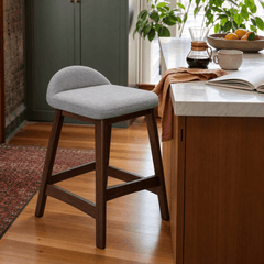 Grey Lyncott counter stool at oak Portland kitchen island - Whats New Furniture