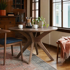 Lyncott Round Dining Table in medium brown styled in a Portland dining room - Whats New Furniture