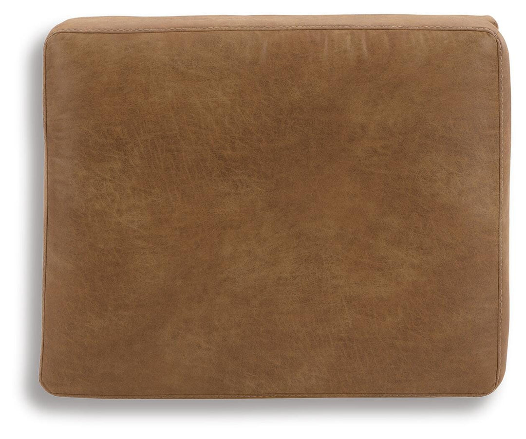 Telora Ottoman top view of the caramel faux leather cushion - Whats New Furniture Portland OR