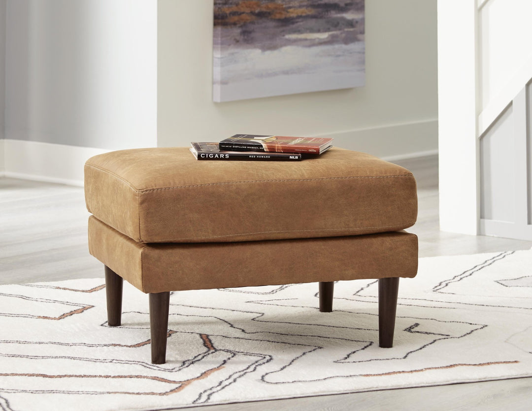Telora Ottoman in caramel faux leather front view - Ashley mid-century ottoman - Whats New Furniture Portland OR