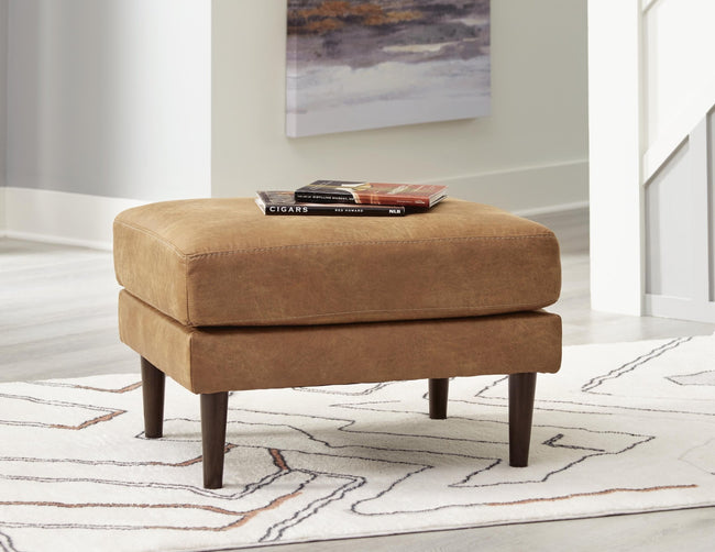 Telora Ottoman in caramel faux leather front view - Ashley mid-century ottoman - Whats New Furniture Portland OR