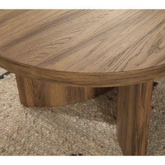 Austanny Coffee Table in Warm Brown detail view - oval rustic oak coffee table by Ashley - Whats New Furniture Portland OR