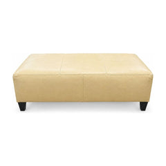 Baby Yellow leather ottoman with a long, low rectangular bench profile.