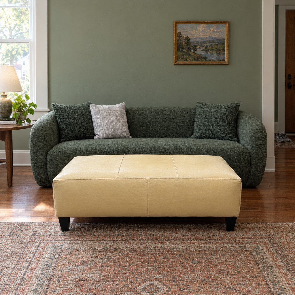 Baby Yellow leather ottoman with a long, low rectangular bench profile. - detail view 1