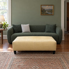 Baby Yellow leather ottoman with a long, low rectangular bench profile. - detail view 1