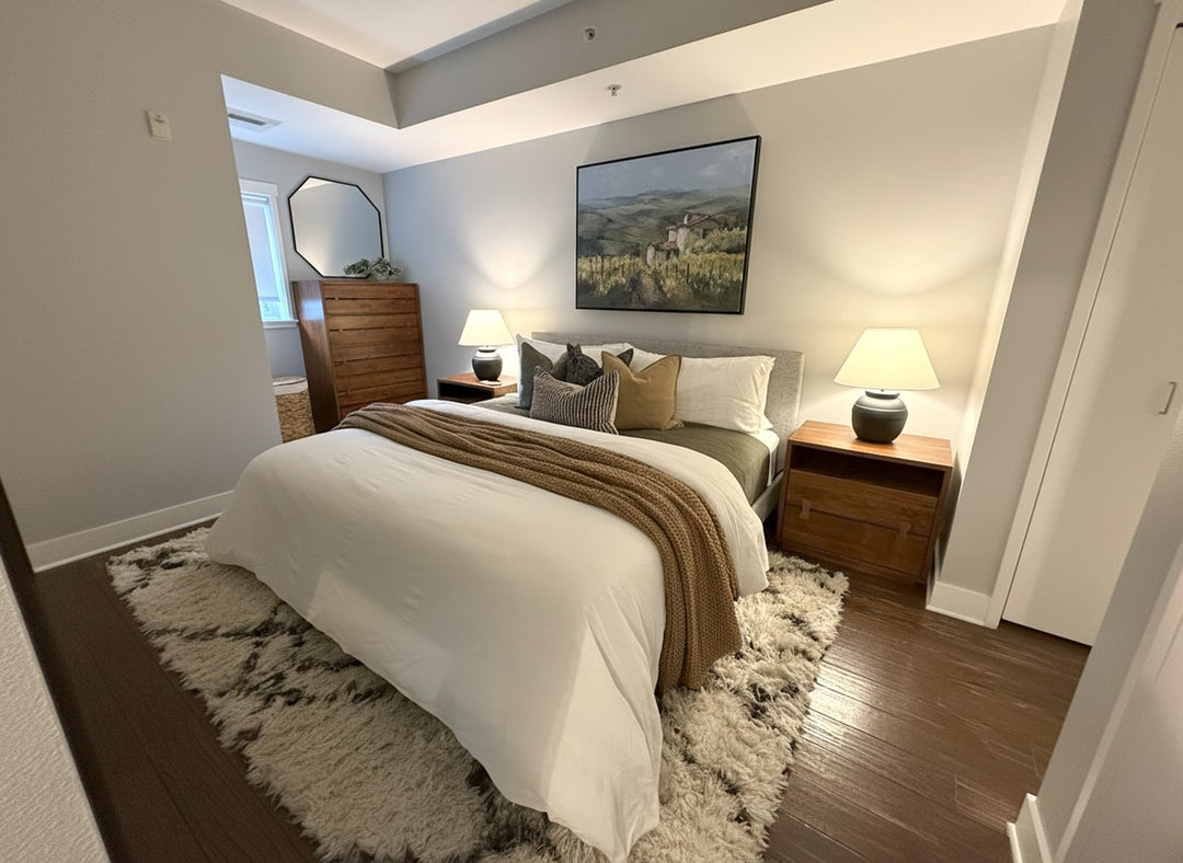 Bedroom suite interior design by Whats New Furniture in Portland Oregon - cozy bed with walnut nightstands and landscape artwork