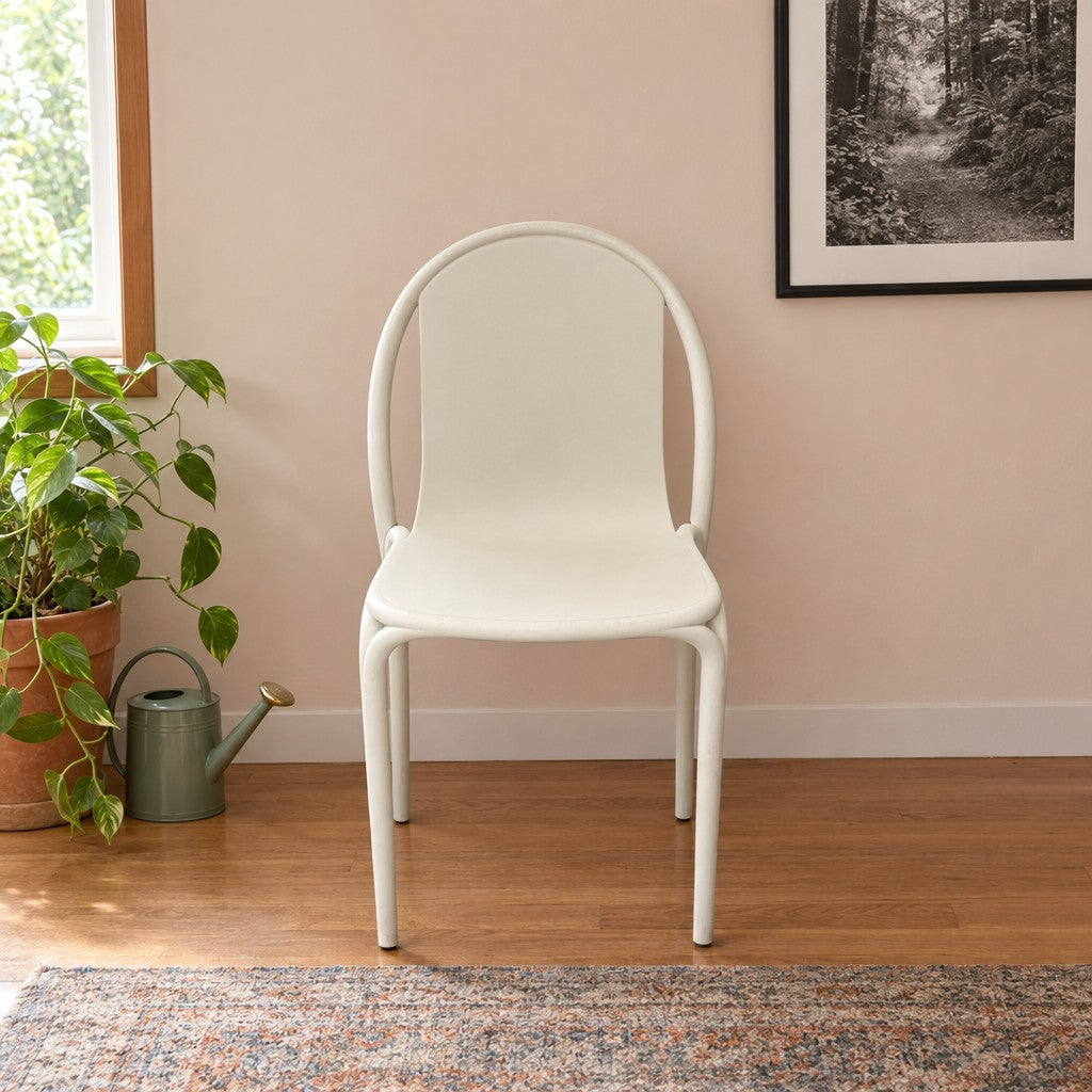 Beige dining chair with a continuous molded shell by Vondom - detail view 1