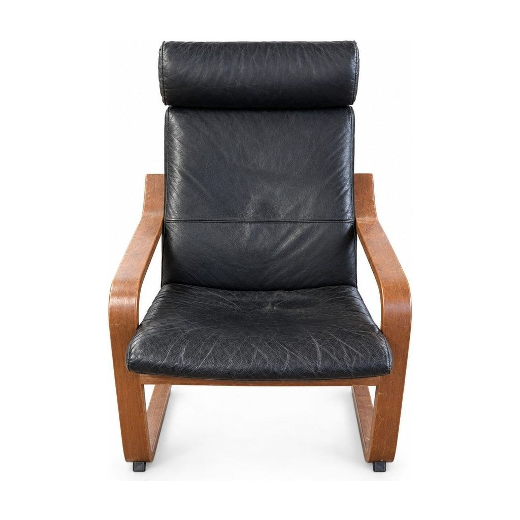 Black lounge chair with distressed fabric upholstery