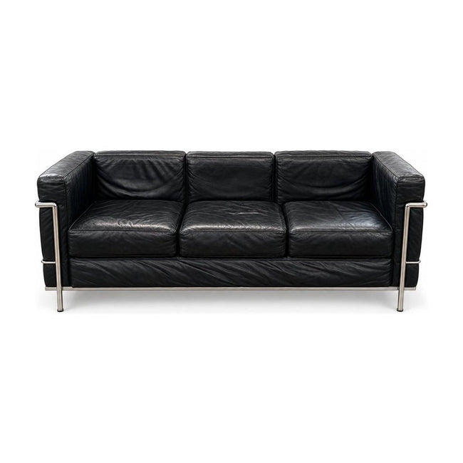 Black leather sofa with cubic cushions and a tubular steel frame - Whats New Furniture Portland OR