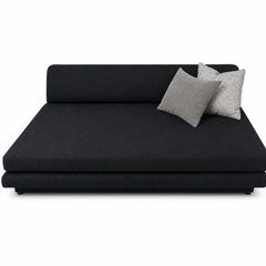Black upholstered plinth lounge chaise longue with a low, grounded base