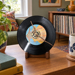 Black vinyl record clock with America the Beautiful album art on the disc. - detail view 1