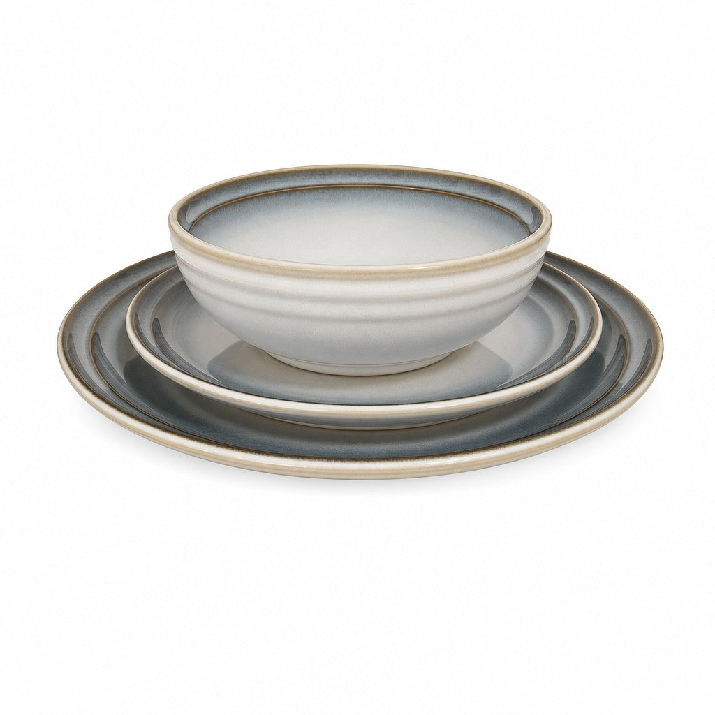Blue-gray stoneware dinnerware set with bowls, salad plates, and dinner plates for four