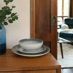 Blue-gray stoneware dinnerware set with bowls, salad plates, and dinner plates for four - view 2