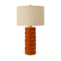 Burnt orange ceramic table lamp with a tapered mid-century body.