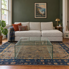 Clear glass coffee table with a low, nearly square top. - detail view 1
