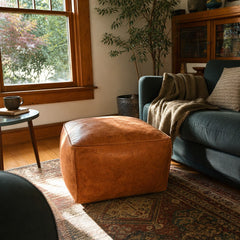 Cognac leather square pouf ottoman with taut cube silhouette and low 15-inch height - detail view 1