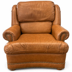 Cognac brown leather mid-century lounge armchair with a solid wood frame and low-slung lines