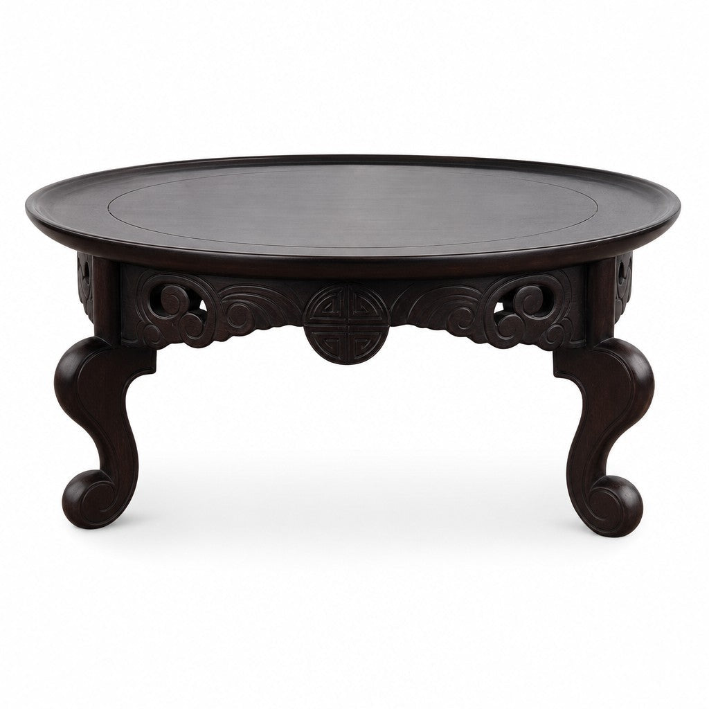 Dark walnut carved wood sculpture with a compact sculptural silhouette