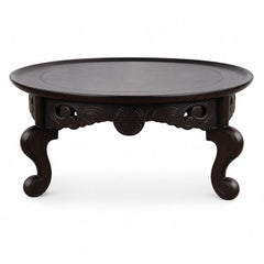 Dark walnut carved wood sculpture with a compact sculptural silhouette
