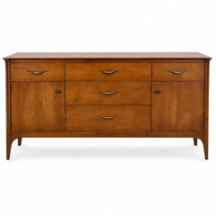 Medium walnut mid-century dresser with clean lines and a low, wide silhouette