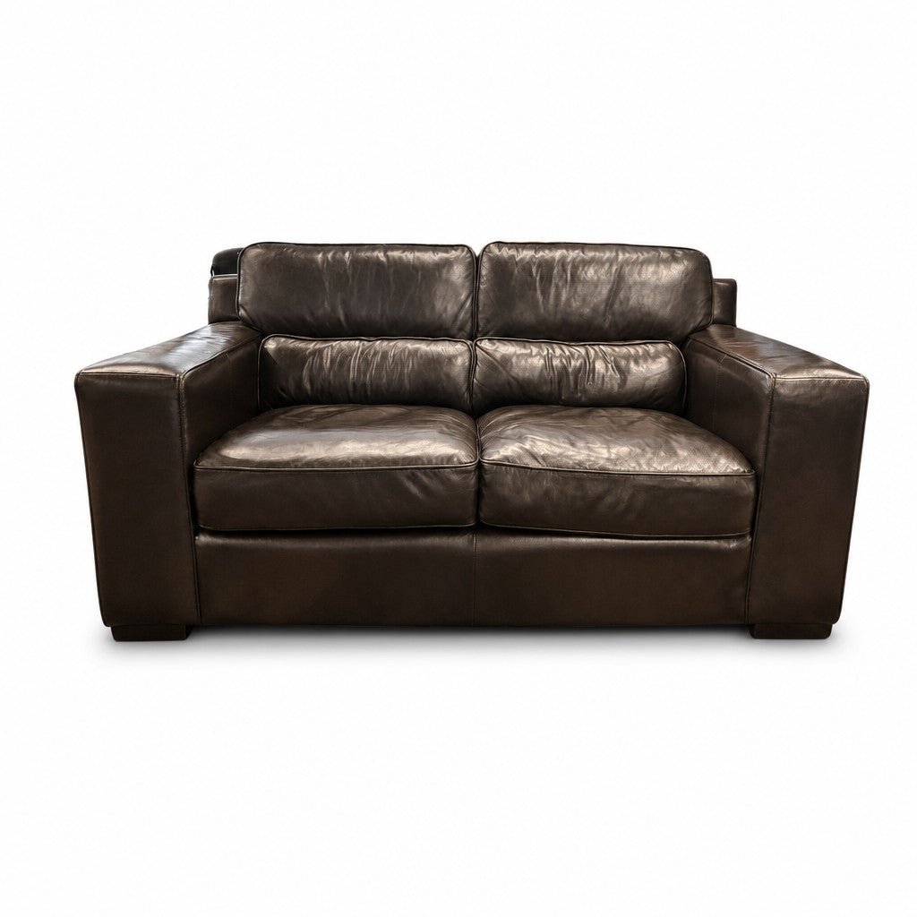 Espresso mid-century sofa with tapered wood legs and clean low lines