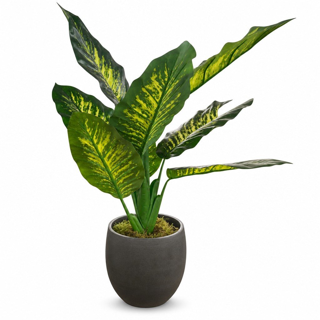 Green faux plant with full leaves in a tall glazed ceramic vase