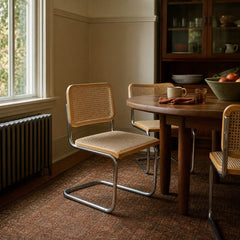 Natural cane and chrome dining chair with a woven cane back and slim polished frame - view 2