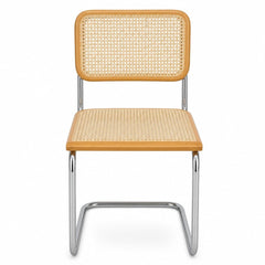 Natural cane and chrome dining chair with a woven cane back and slim polished frame
