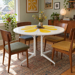White / Yellow mid-century dining table with a two-tone laminate top and tapered legs. - detail view 1